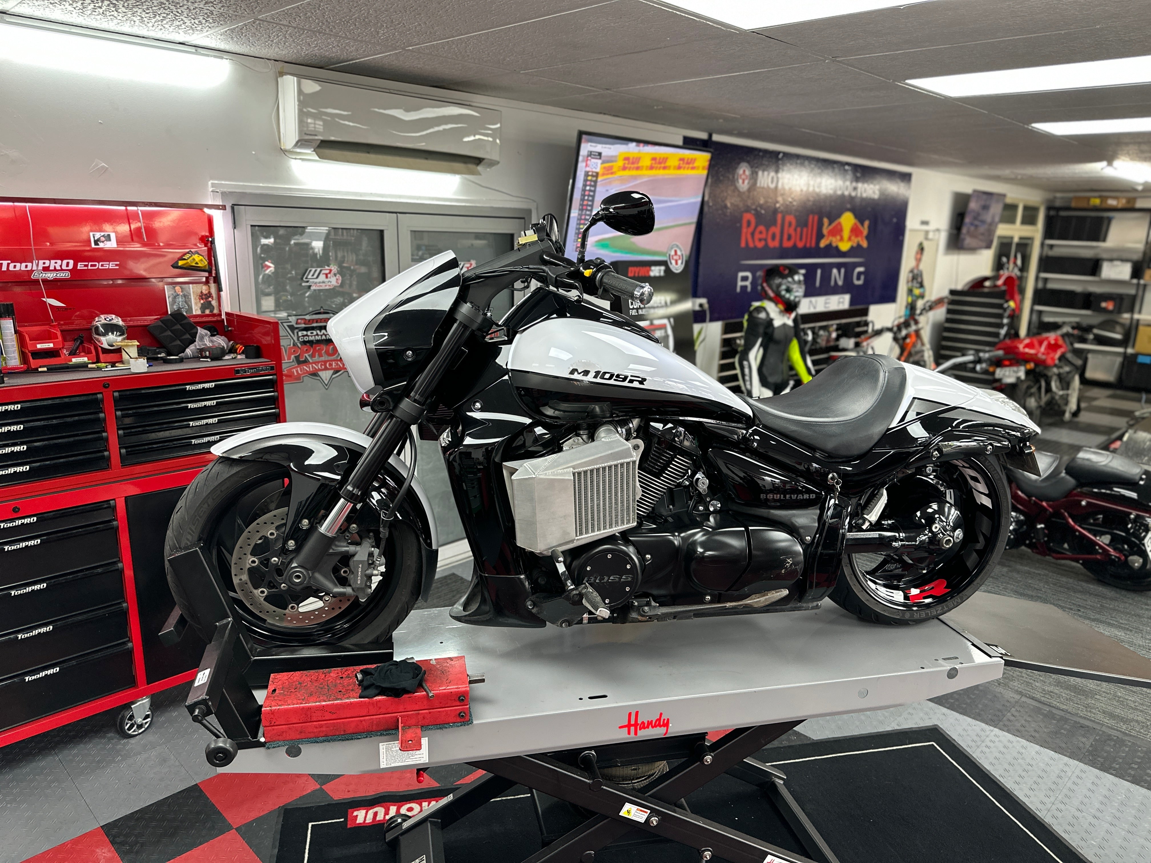 Dyno tuning performance test work of a motorcycle at Motorcycle Doctors workshop in Auckland
